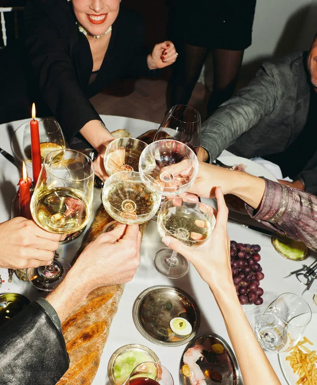 A table of members toasting